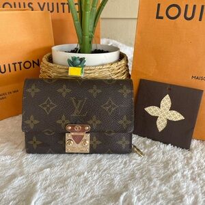 Louis Vuitton Brown Monogram Clutch with Gold Accents